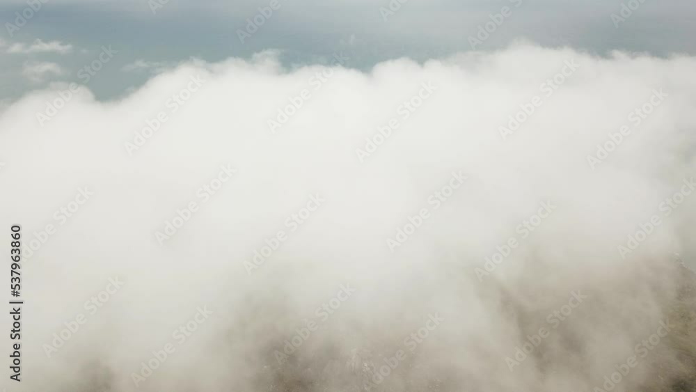 Drone aerial flying towards and into white clouds Drone aerial flying towards and into white clouds