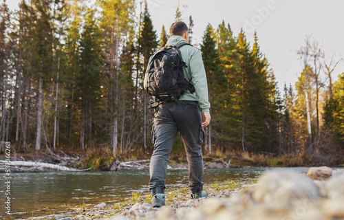 person walking in autumn forest