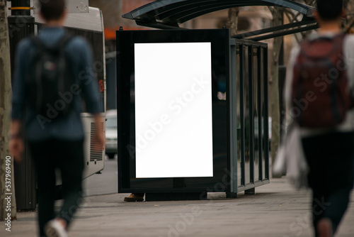 Blank roadside advertising board with flowing traffic