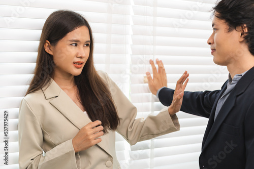Panic, disgusted asian young employee, pressure business woman defending hand of colleague, push out protect when boss touching her body, embrace. Sexual harassment inappropriate at office,workplace.