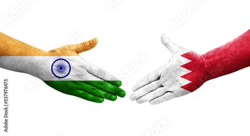 Handshake between Bahrain and India flags painted on hands, isolated transparent image.