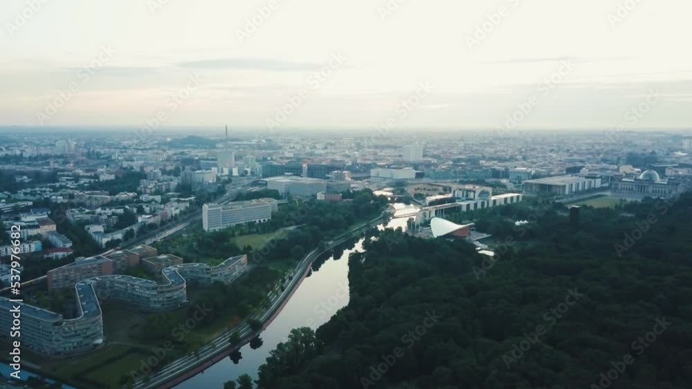 Drone aerial pan left towards Berlin city with a river during sunrise Drone aerial pan left towards Berlin city with a river during sunrise