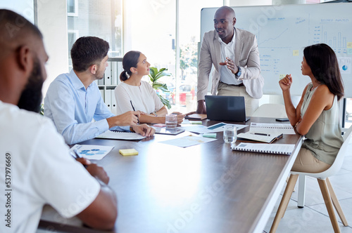 Black man, speaker and laptop presentation in business meeting, strategy planning and digital marketing global office boardroom. Talking manager, mentor and leadership technology in teamwork training