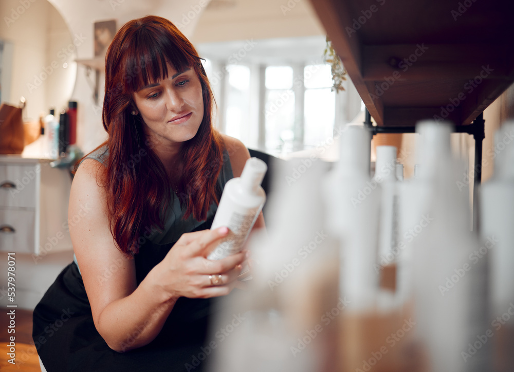 Hairdresser salon and professional stylist woman reading shampoo