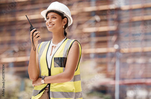 Construction worker, smile and radio with woman for communication in logistics, engineering and safety. Leadership, planning and inspection with employee working on project management development
