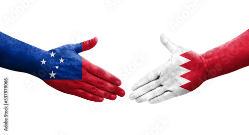 Handshake between Bahrain and Samoa flags painted on hands, isolated transparent image.