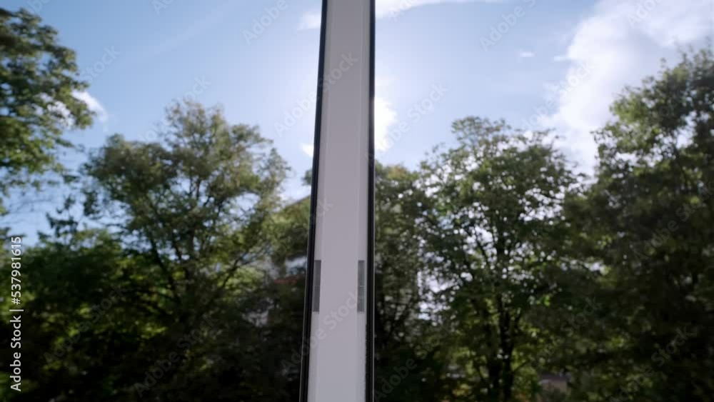 hands open a window with a magnificent landscape view of nature on a summer sunny day. hands open a window with a magnificent landscape view of nature on a summer sunny day.