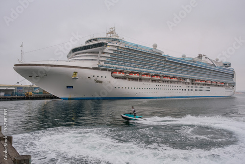 Princess cruiseship or cruise ship liner Ruby San Diego terminal for Mexican Riviera cruising with downtown skyline blue sky sunny day	 photo