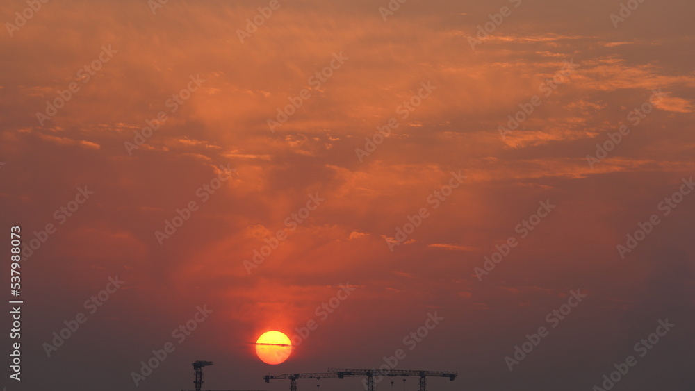 Fototapeta premium The beautiful sunset view with the colorful clouds and sky in the city