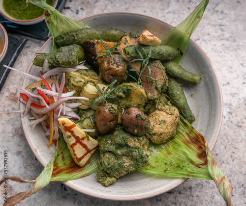 Typical dish of Peru, Pachamanca. Food from Peru on a white plate.