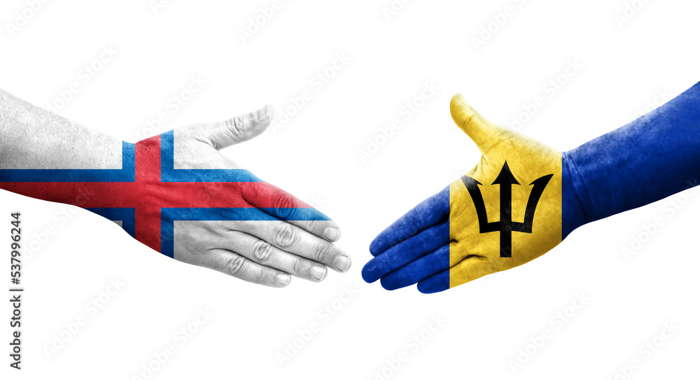 Handshake between Barbados and Faroe Islands flags painted on hands, isolated transparent image. Handshake between Barbados and Faroe Islands flags painted on hands, isolated transparent image.