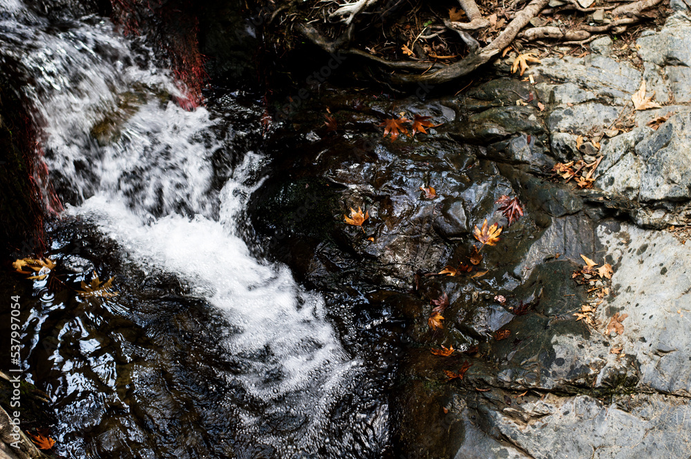 A stream among stones and rocks, nature A stream among stones and rocks, nature