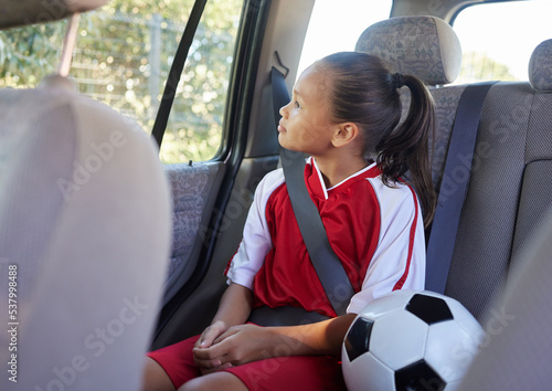 Obraz na plátně Child in car interior, travel transport to football and soccer athlete sitting in motor vehicle