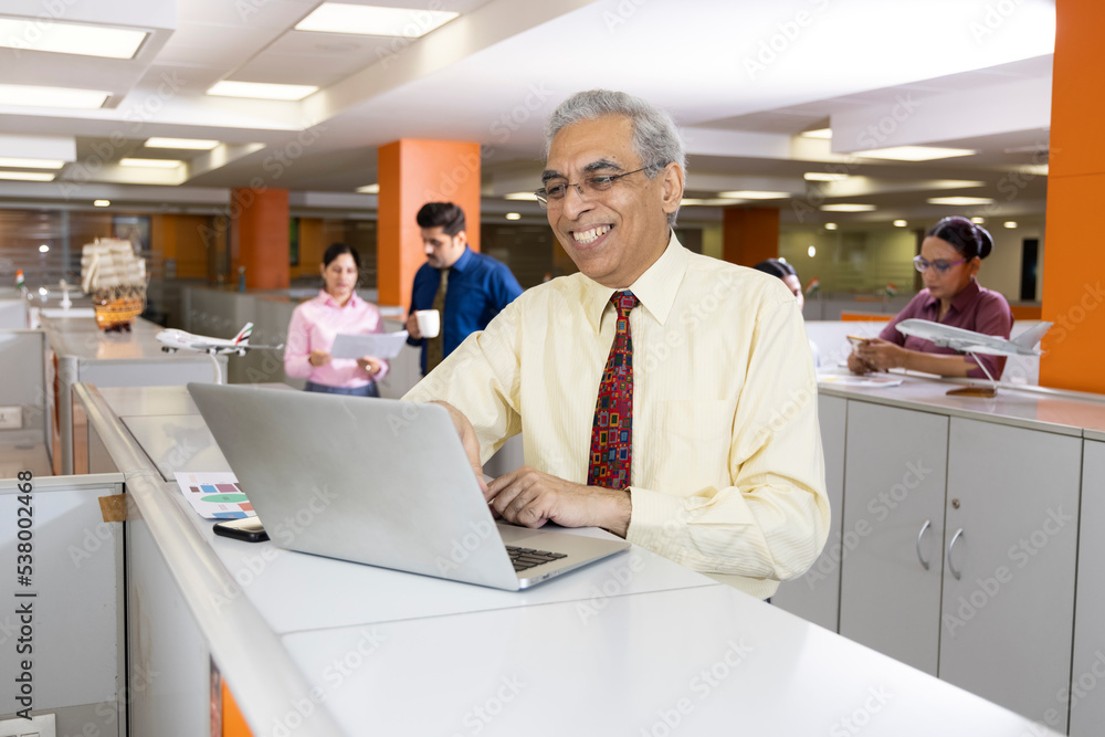 Businessman using laptop at office Businessman using laptop at office