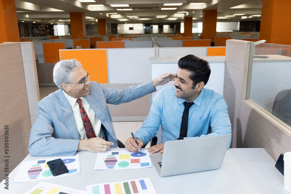 Obraz premium Man with old father using laptop while planning budget finance in office.