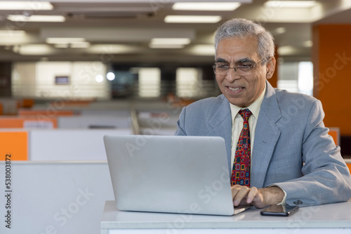 Photography Video conferencing using laptop at office.