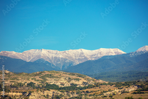 Mountain ridge with blue sky. Mountain landscape on an autumn sunny day © vvvita