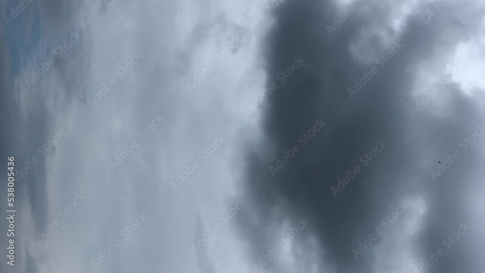 vertical time lapse of clouds passing fast against blue sky heavy rain forecast weather vertical time lapse of clouds passing fast against blue sky heavy rain forecast weather