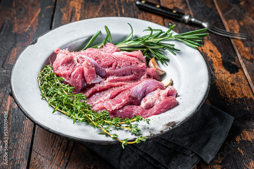 Pieces of raw turkey thigh, Poultry fresh meat. Wooden background. Top view