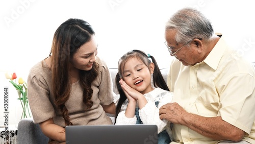 Happy family Multi-generation selfie with using smartphone on sofa at living room, Mobile technology people lifestyle online connection video call with wifi concept.