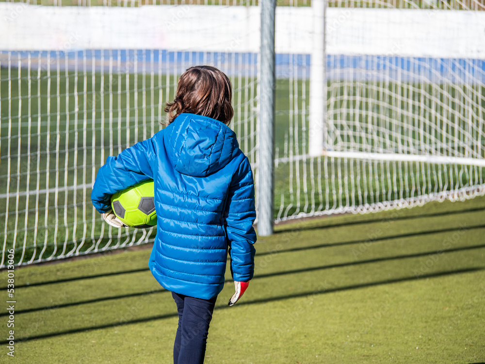 anonymous girl with a ball in her hand