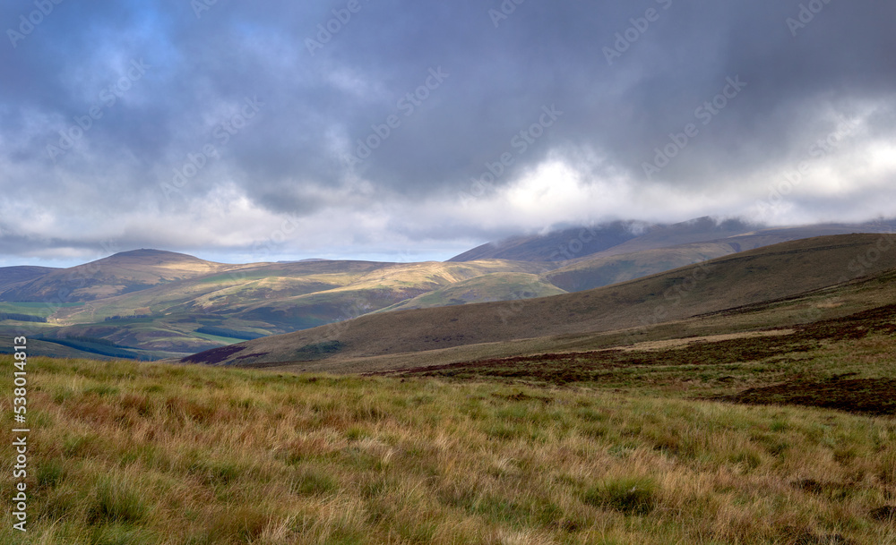Views of The Cheviot covered in cloud from below Windy Gyle in Northumberland, Scottish Borders, England UK.