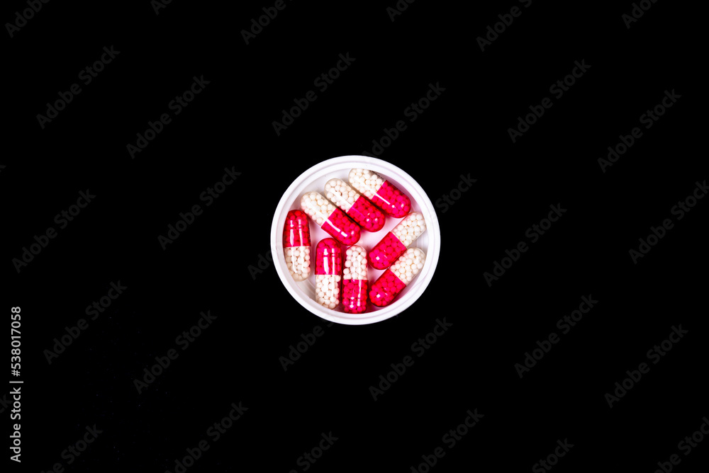 Medical pills on isolated on black background Medical pills on isolated on black background