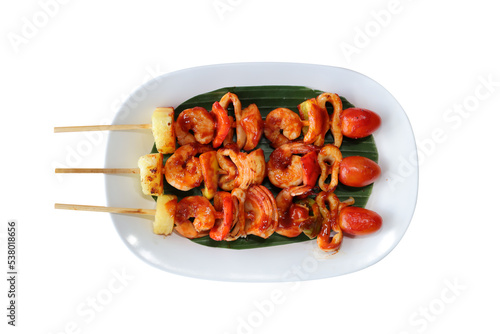 Top view of Grilled Seafood and vegetables isolated on white background.