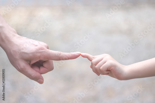 Asian father index finger collided with daughter girl hand on background ,father day © Amphawan