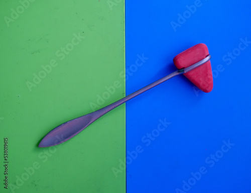 Taylor percussion reflex hammer on a colourful background  photo