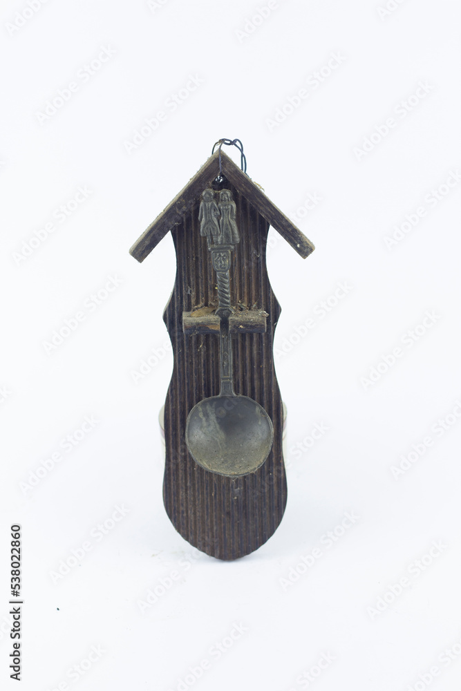old souvenir isolated at white background, the souvenir is wooden with spoon retro and vintage traditional style old souvenir isolated at white background, the souvenir is wooden with spoon retro and vintage traditional style