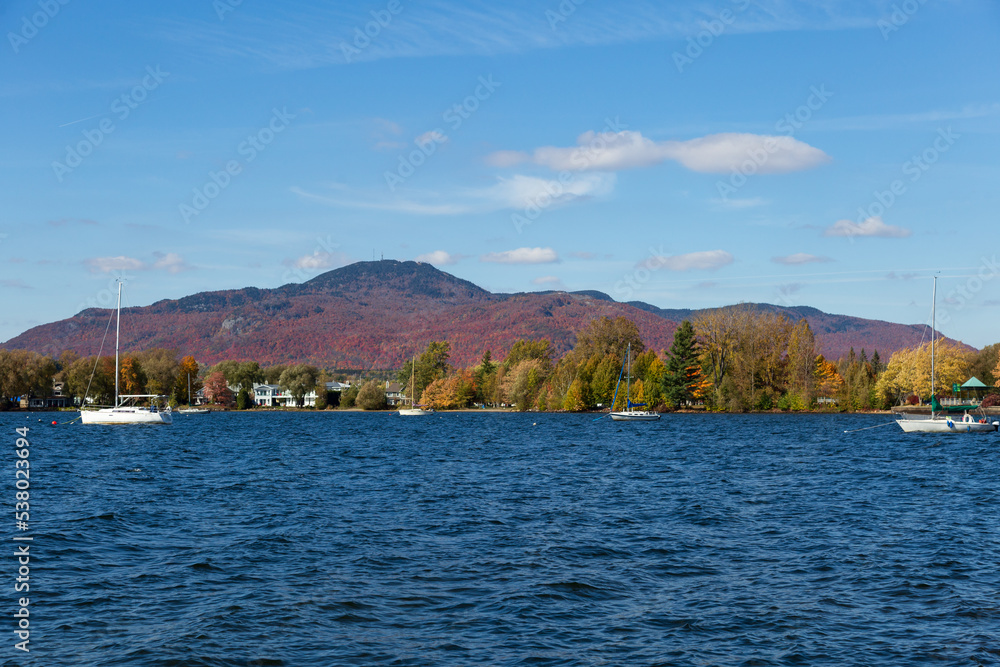 Lake Memphremagog seen with Mount Orford in the background during a sunny fall afternoon, Magog, Eastern Townships, Quebec, Canada