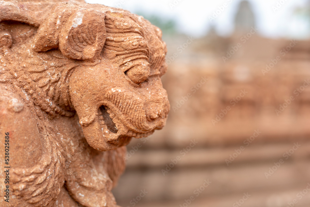 Selective Focus Ancient Lion Statue or Mythical Lion sculpture on the walls of the ancient 13th century A.D. Suka Sari temples, Old Town, Bhubaneswar, Odisha, India.