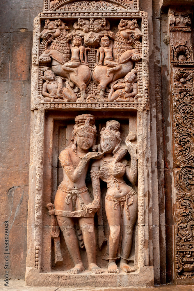 Ancient sandstone carvings on the walls of the ancient Indian temple.13th century A.D. Suka Sari temple Odisha, India.