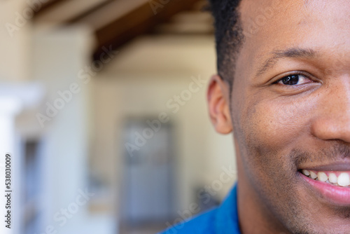Portrait of happy african american man looking at camera and smiling photo