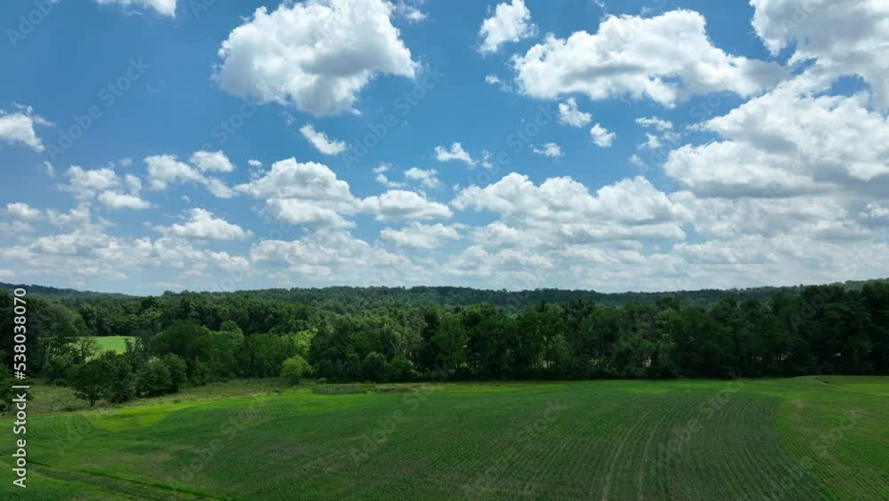 An aerial view over the lush green farmland in southern Lancaster County, Pennsylvania on a sunny summer day. An aerial view over the lush green farmland in southern Lancaster County, Pennsylvania on a sunny summer day.