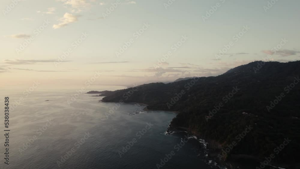 drone over wild jungle coastline during sunset in costa rica drone over wild jungle coastline during sunset in costa rica