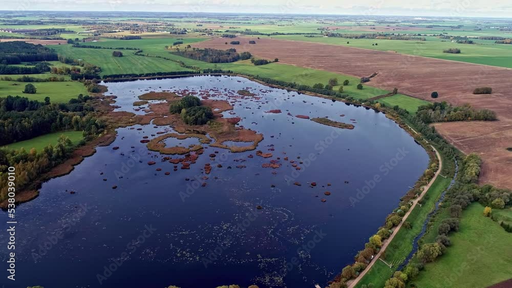 Aerial View of Idyllic Countryside Lake and Plain Agricultural Fiends Drone Shot