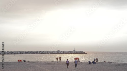 golden hour people walk on Venice beach of Los Angeles ,USA. photo