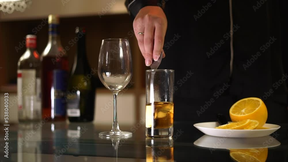 The girl mixing cocktail in the home bar. Negroni sbagliato alcoholic drink from the Game of Thrones actress. High quality FullHD footage The girl mixing cocktail in the home bar. Negroni sbagliato alcoholic drink from the Game of Thrones actress. High quality FullHD footage