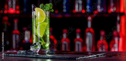 Fotografi Cocktail with ice on bar counter in a restaurant, pub