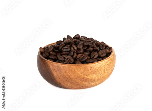 Wooden bowl full of coffee beans on a white background.