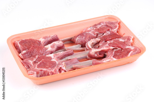 Raw chops in plate package isolated