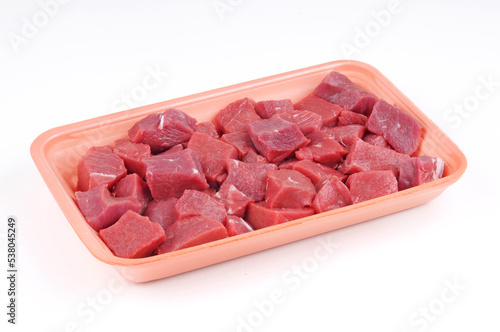 Raw Beef cubes in plate package isolated