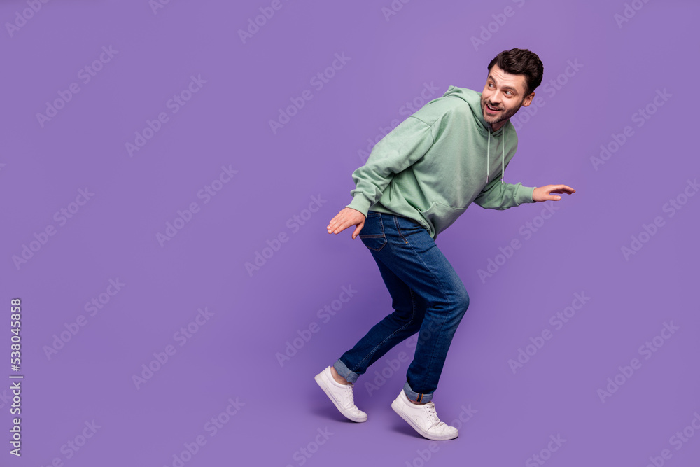 Full length side profile photo of nervous funny man look empty space walk silent robbery dont want wake up owners isolated on pastel violet color background