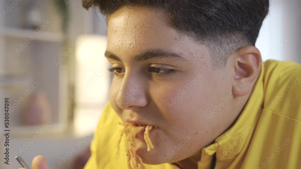 Obesity problem.
Being overweight and overeating. The child is eating pasta.
Obesity problem.
Being overweight and overeating. The child is eating pasta.