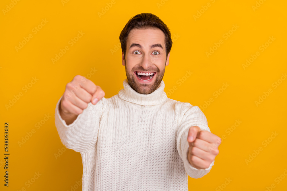 Photo of crazy careless driver guy hands hold imaginary steering wheel wear white sweater isolated yellow color background Photo of crazy careless driver guy hands hold imaginary steering wheel wear white sweater isolated yellow color background