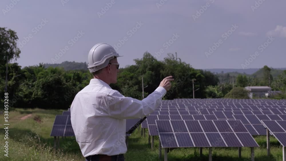 Solar farm (solar panels) with engineers using a tablet to check the system's operation. Alternative energy for world energy conservation Photovoltaic module concept for clean energy generation
Solar farm (solar panels) with engineers using a tablet to check the system's operation. Alternative energy for world energy conservation Photovoltaic module concept for clean energy generation