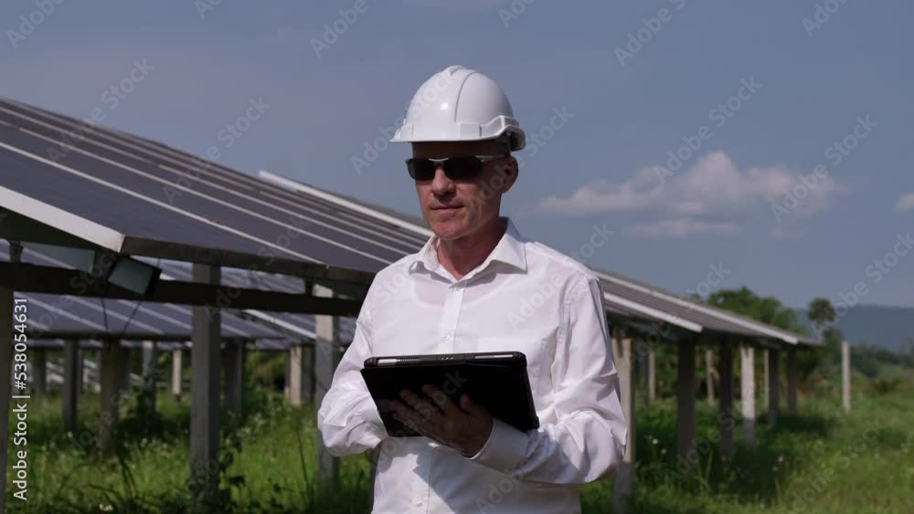 Solar farm (solar panels) with engineers using a tablet to check the system's operation. Alternative energy for world energy conservation Photovoltaic module concept for clean energy generation
Solar farm (solar panels) with engineers using a tablet to check the system's operation. Alternative energy for world energy conservation Photovoltaic module concept for clean energy generation