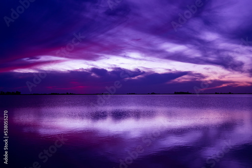 blue hour in a lagoon. Clouds cover the sky.